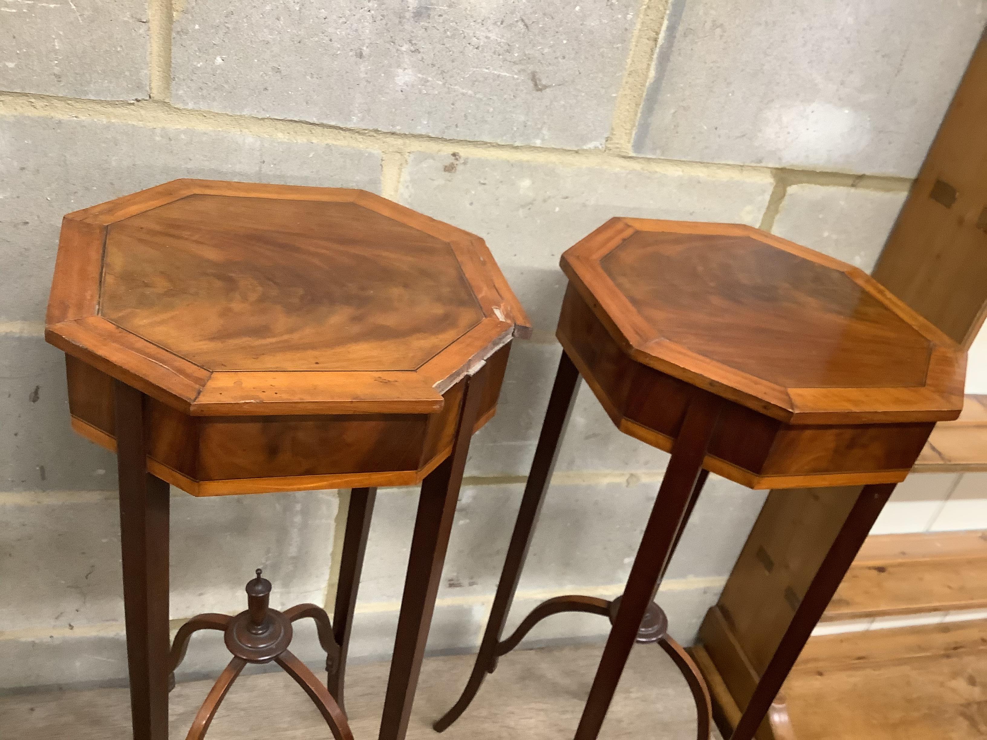 A pair of Sheraton style octagonal inlaid mahogany urn stands, width 33cm, height 75cm